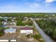 Panoramic aerial view displaying the home nestled in a wooded area with surrounding neighborhood at 6440 Curtiss Ln, Spring Hill, FL 34609