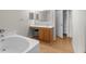 Primary bathroom with a vanity, soaker tub, and lots of storage at 6440 Curtiss Ln, Spring Hill, FL 34609