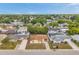 A residential aerial view showing the home and surrounding neighborhood at 7035 Cutty Sark Dr, Port Richey, FL 34668