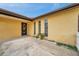 Charming stucco home with inviting front door and manicured landscaping at 7035 Cutty Sark Dr, Port Richey, FL 34668