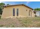 Charming single-story home with unique architectural details, well-manicured lawn and gated front entrance at 7035 Cutty Sark Dr, Port Richey, FL 34668