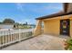 Inviting home exterior with wrought iron gate and manicured garden at 7035 Cutty Sark Dr, Port Richey, FL 34668