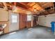Spacious garage with a white door, ample lighting and windows for natural light, creating a functional space at 7035 Cutty Sark Dr, Port Richey, FL 34668