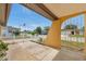 Inviting porch with patterned gate and view of a quiet residential street at 7035 Cutty Sark Dr, Port Richey, FL 34668
