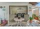 Covered back patio featuring an outdoor sink, washer, dryer, and a seating area at 713 715 W Fribley St, Tampa, FL 33603