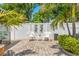 Cozy backyard with seating, lush foliage, and a tranquil atmosphere for relaxation and outdoor enjoyment at 713 715 W Fribley St, Tampa, FL 33603