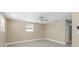 Bedroom with tiled floors, modern ceiling fan, window with blinds, and a closet at 713 715 W Fribley St, Tampa, FL 33603