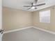 Neutral bedroom with a ceiling fan and tile flooring at 713 715 W Fribley St, Tampa, FL 33603