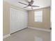 Cozy bedroom with a closet, ceiling fan, and natural light at 713 715 W Fribley St, Tampa, FL 33603