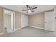 Bedroom features tiled floors, closet, modern ceiling fan, and an open doorway to the bathroom at 713 715 W Fribley St, Tampa, FL 33603