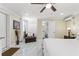 Bright bedroom with ceiling fan, ensuite bathroom, closet, and exterior entrance at 713 715 W Fribley St, Tampa, FL 33603