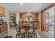 Dining area featuring a round table with seating, granite countertops, and built-in cabinets at 713 715 W Fribley St, Tampa, FL 33603