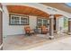 Cozy front porch with seating, decorative tile, and classic architectural details at 713 715 W Fribley St, Tampa, FL 33603