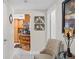 Inviting hallway featuring tile flooring and a glimpse into the kitchen with wooden cabinetry at 713 715 W Fribley St, Tampa, FL 33603