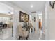 Charming hallway featuring tile floors, stylish console table, and access to multiple rooms at 713 715 W Fribley St, Tampa, FL 33603