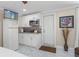 A convenient kitchenette area features white cabinets, a microwave, and is adjacent to the bedroom space at 713 715 W Fribley St, Tampa, FL 33603