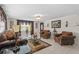 Elegant living room featuring stylish furniture, tile floors, and plenty of natural light at 713 715 W Fribley St, Tampa, FL 33603