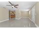 Living room with tiled floors and view into the updated kitchen with wooden cabinets at 713 715 W Fribley St, Tampa, FL 33603
