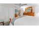 Comfortable main bedroom featuring a dresser, ceiling fan, and ample closet space at 713 715 W Fribley St, Tampa, FL 33603