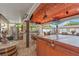 Resort-style covered outdoor kitchen features a full bar, multiple TVs, and a relaxing hot tub at 713 715 W Fribley St, Tampa, FL 33603