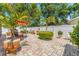 Relaxing patio with brick pavers, landscaping, and outdoor seating at 713 715 W Fribley St, Tampa, FL 33603