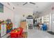 Inviting playroom has cheerful decor, ceiling fans, and plenty of space for activities and play at 713 715 W Fribley St, Tampa, FL 33603