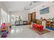 Spacious playroom is filled with an assortment of toys, play equipment, and bright decor at 713 715 W Fribley St, Tampa, FL 33603