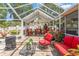Inviting screened patio is perfect for relaxing and entertaining with comfortable seating and decorative accents at 713 715 W Fribley St, Tampa, FL 33603