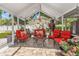 Relaxing screened patio is perfect for gatherings with comfortable seating and beautiful decor at 713 715 W Fribley St, Tampa, FL 33603