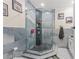 Stylish shower area with sleek glass enclosure, decorative tiles, and modern fixtures at 713 715 W Fribley St, Tampa, FL 33603