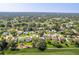 Aerial of 7499 Blue Skies Dr in Spring Hill, Florida, situated in The Country Club of the Pines at 7499 Blue Skies Dr, Spring Hill, FL 34606