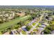 An aerial view showing the proximity of the home to the golf course and the surrounding community at 7499 Blue Skies Dr, Spring Hill, FL 34606