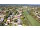 Enjoy an aerial view of this home and the surrounding community, including proximity to golf course and nearby Spring Hill at 7499 Blue Skies Dr, Spring Hill, FL 34606