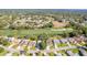 Beautiful aerial view of a well-kept community, golf course, and the home's location at 7499 Blue Skies Dr, Spring Hill, FL 34606