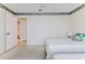 The bedroom features wood floors, decorative trim, and includes an adjacent bathroom and closet at 7499 Blue Skies Dr, Spring Hill, FL 34606