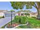 Charming single-story home with a well-manicured lawn and mature tree providing shade at 7499 Blue Skies Dr, Spring Hill, FL 34606