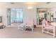 The large screened lanai offers seamless access to the main bedroom, dining room, and a view of the property at 7499 Blue Skies Dr, Spring Hill, FL 34606