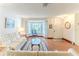 Bright living room featuring hardwood floors, bay window, and neutral decor at 7499 Blue Skies Dr, Spring Hill, FL 34606