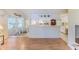 Open-concept living room with a view into the kitchen and dining nook at 7499 Blue Skies Dr, Spring Hill, FL 34606