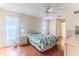The main bedroom features a ceiling fan, and an ensuite bathroom at 7499 Blue Skies Dr, Spring Hill, FL 34606