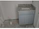 Bathroom vanity featuring grey cabinets and granite countertops under construction at 7583 St Andrews Blvd, Weeki Wachee, FL 34613