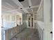 Unfinished interior of a new home, revealing the stud walls, ceiling, and layout of the kitchen and living spaces at 7583 St Andrews Blvd, Weeki Wachee, FL 34613