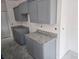 A kitchen featuring grey cabinets, and granite countertops, under construction at 7583 St Andrews Blvd, Weeki Wachee, FL 34613