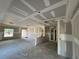 Unfinished living room displaying new drywall, coffered ceiling, and an open layout ready for finishing touches at 7583 St Andrews Blvd, Weeki Wachee, FL 34613