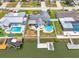 Aerial view of a waterfront home with a pool, dock, and canal access, perfect for boating enthusiasts at 7626 Hatteras Dr, Hudson, FL 34667