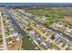 Panoramic aerial view showcasing the canal-front homes and the community's proximity to the open sea at 7626 Hatteras Dr, Hudson, FL 34667