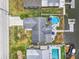 Waterfront home with an above ground pool and boat dock, offering an idyllic setting for outdoor recreation and relaxation at 7626 Hatteras Dr, Hudson, FL 34667