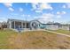 Large backyard features a patio and outdoor seating, perfect for entertaining guests at 7626 Hatteras Dr, Hudson, FL 34667