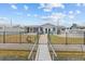 Charming backyard with patio, pool, and direct access to the canal and waterfront at 7626 Hatteras Dr, Hudson, FL 34667