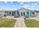 Outdoor patio and backyard features open space, ample seating, and manicured lawn at 7626 Hatteras Dr, Hudson, FL 34667